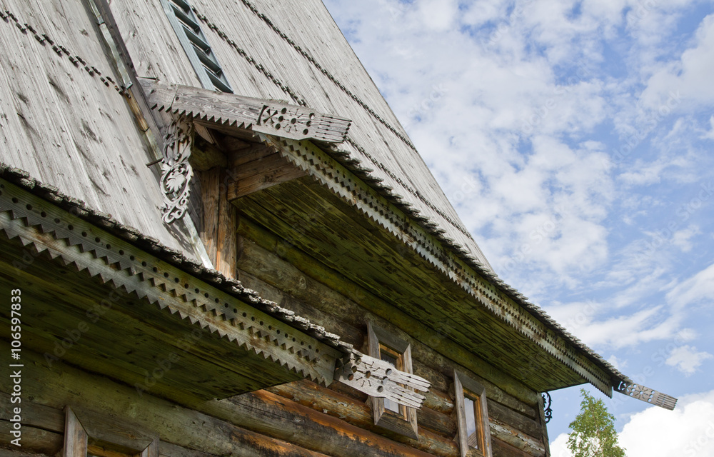 carving of the wooden Orthodox Russian Church in the background of cloudy sky carving of the wooden Orthodox Russian Church in the background of cloudy sky