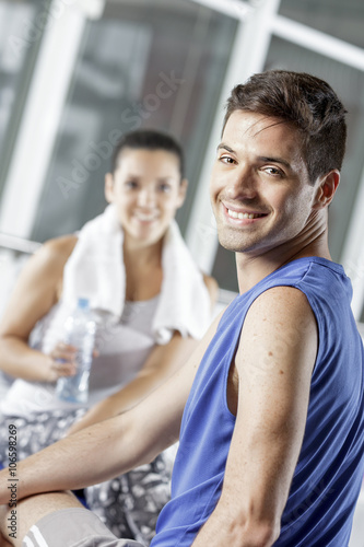 young man exercising with woman trainer