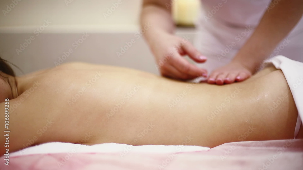 Attractive young woman relaxing with hand massage at beauty spa Attractive young woman relaxing with hand massage at beauty spa
