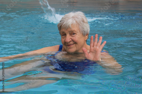 Senior woman swimming in a pool