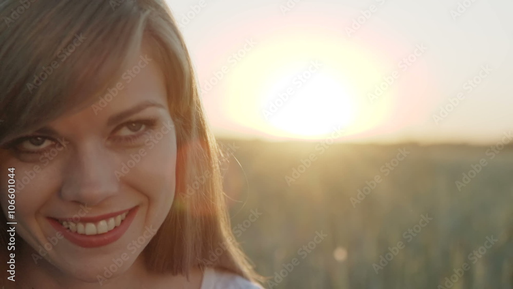 Woman opens her eyes and feels happy at sunset Woman opens her eyes and feels happy at sunset