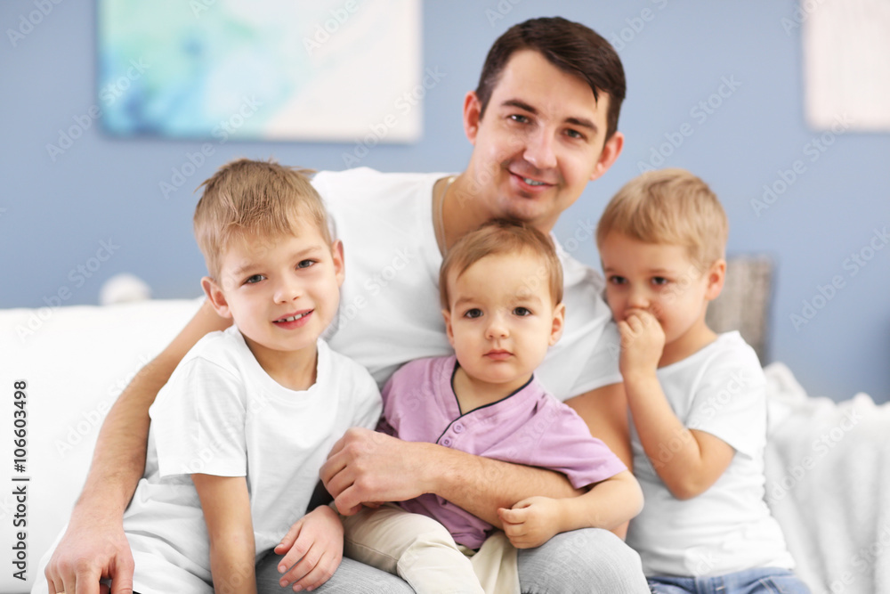 Family concept. Father with sons are in the room