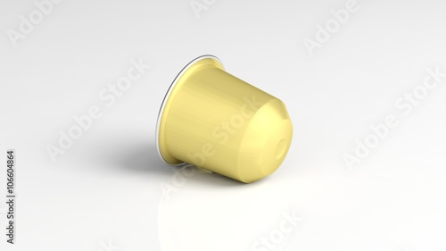 Golden coffee capsule, isolated on white background.