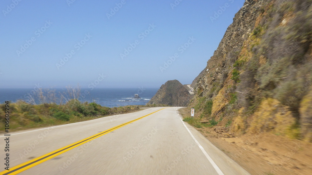 Vehicle point-of-view on Pacific Coast Highway (aka Cabrillo Highway or California Highway 1) in the Big Sur area of Central California Vehicle point-of-view on Pacific Coast Highway (aka Cabrillo Highway or California Highway 1) in the Big Sur area of Central California