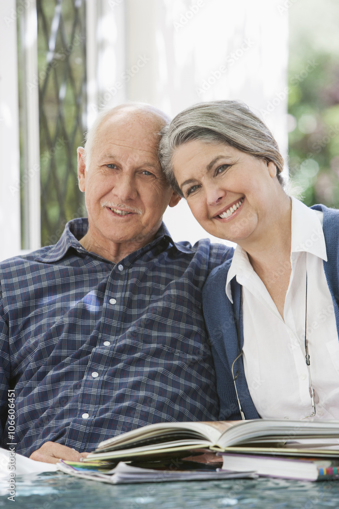Senior Caucasian couple reading outdoors Senior Caucasian couple reading outdoors