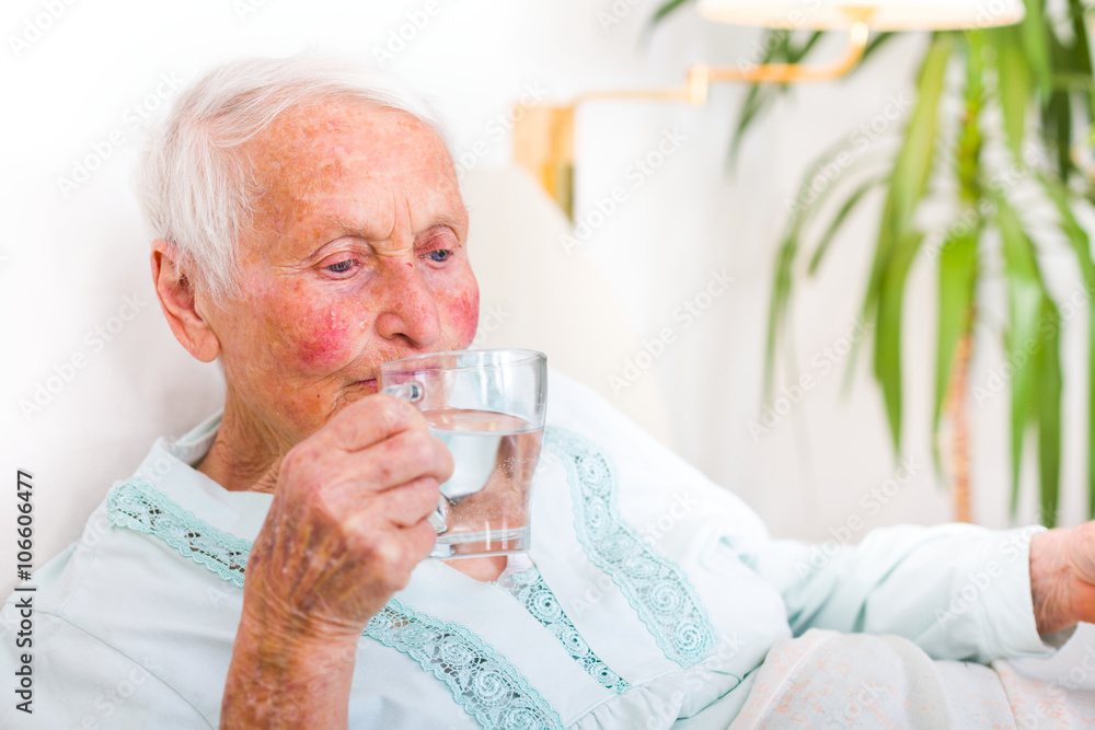Senior woman drinking water Senior woman drinking water