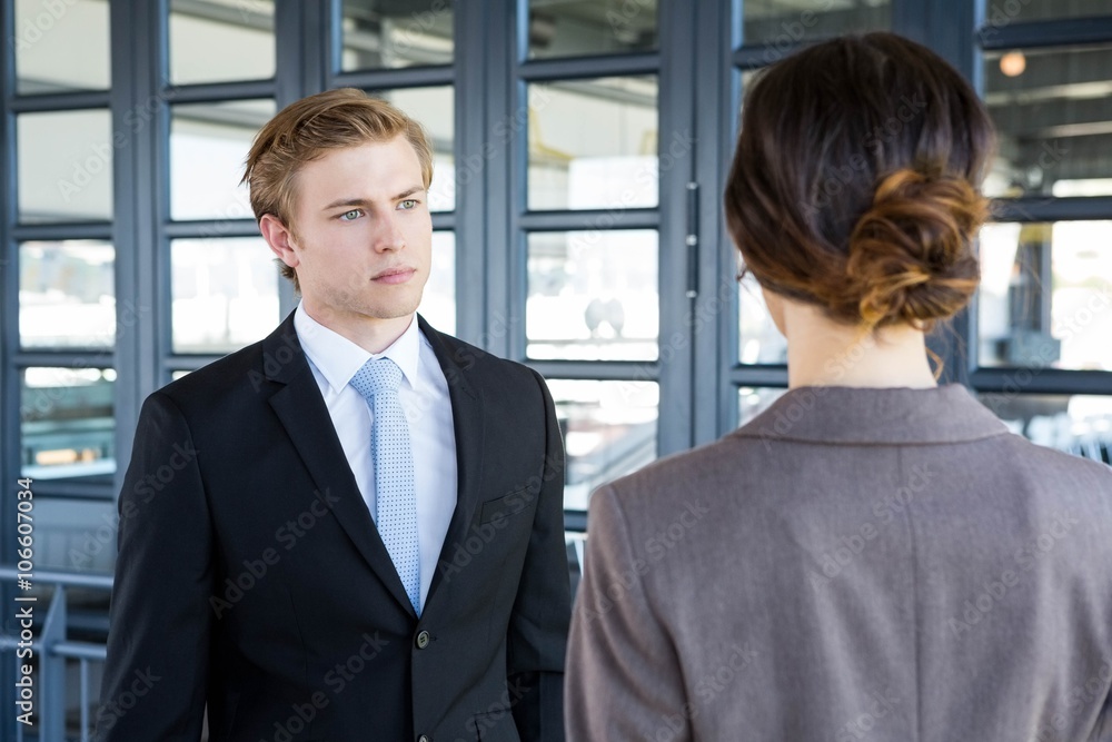 Businessman interacting with his business colleague Businessman interacting with his business colleague