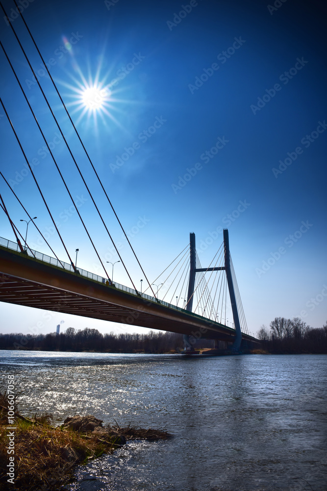 Obraz premium Warsaw Siekierkowski bridge in the glare of sunlight