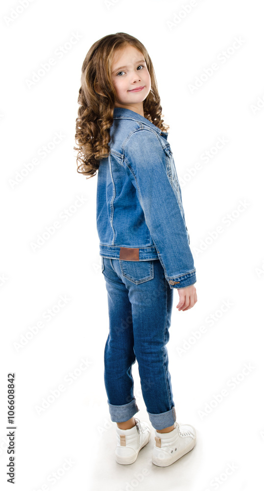 Cute smiling little girl in jeans isolated Cute smiling little girl in jeans isolated