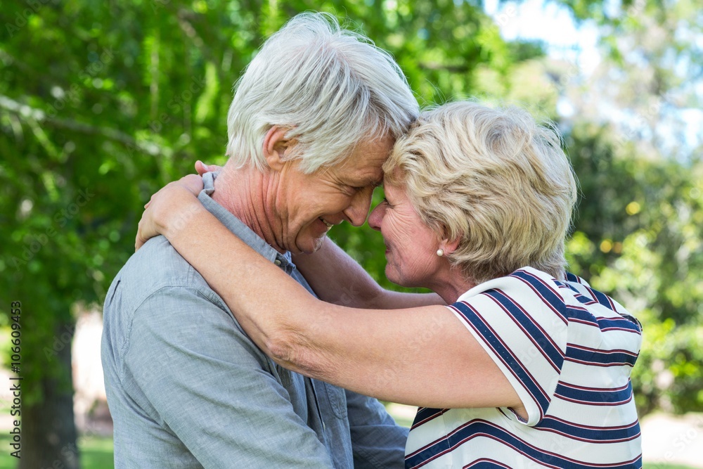 Senior couple embracing head to head Senior couple embracing head to head