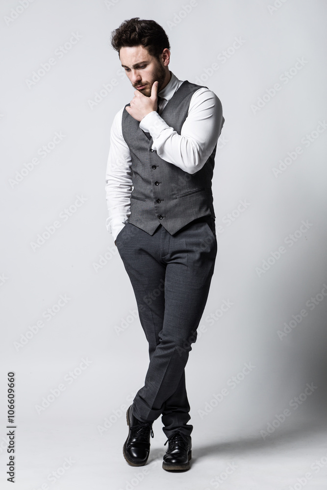 Handsome young businessman thinking. Isolated on white. Handsome young businessman thinking. Isolated on white.