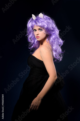 cosplay woman in black dress and purple wig
