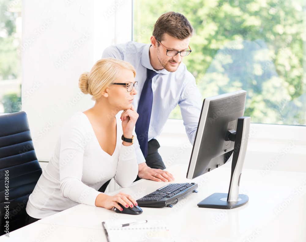 Office workers in formalwear working in office Office workers in formalwear working in office
