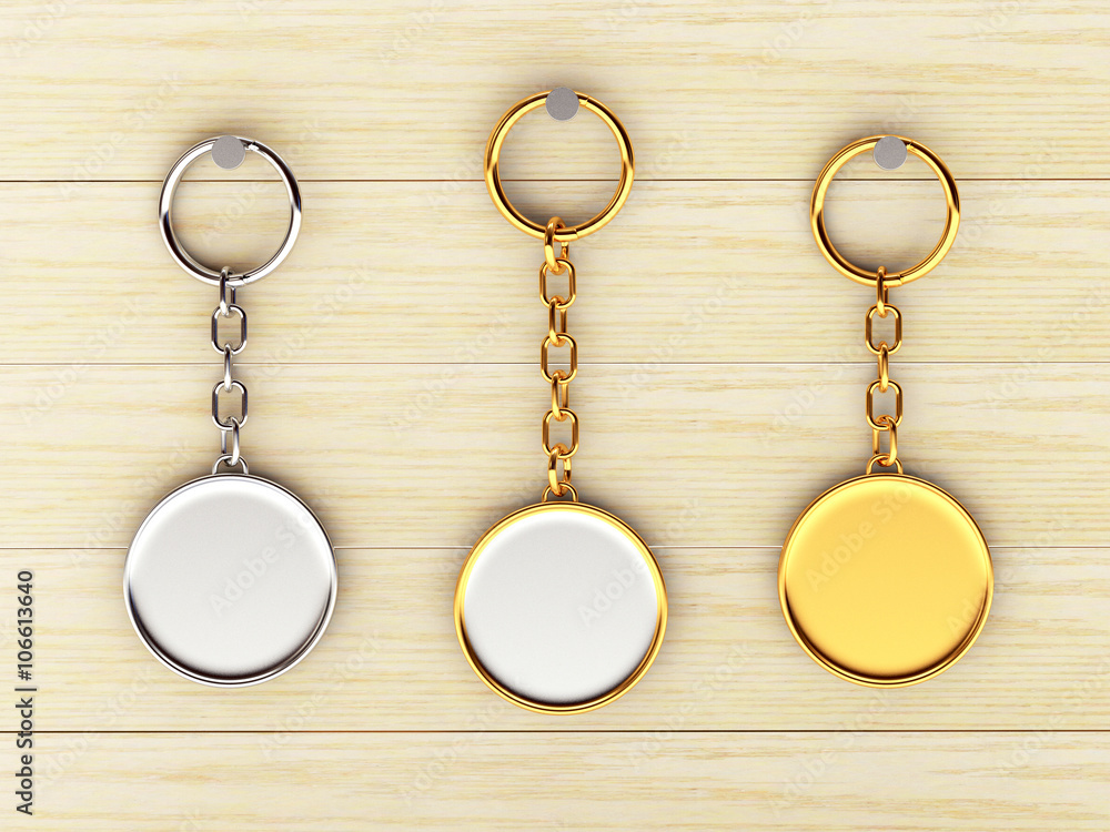 Set of blank round golden and silver keychains is hanging on the wooden wall. 3d illustration Set of blank round golden and silver keychains is hanging on the wooden wall. 3d illustration