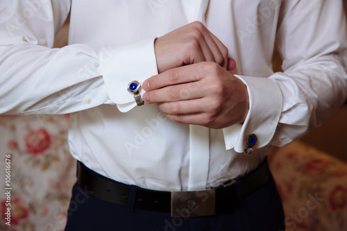 Gentlemans hands with cufflinks