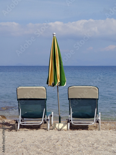 Fototapeta Naklejka Na Ścianę i Meble -  Sunbeds and umbrellas on the beach