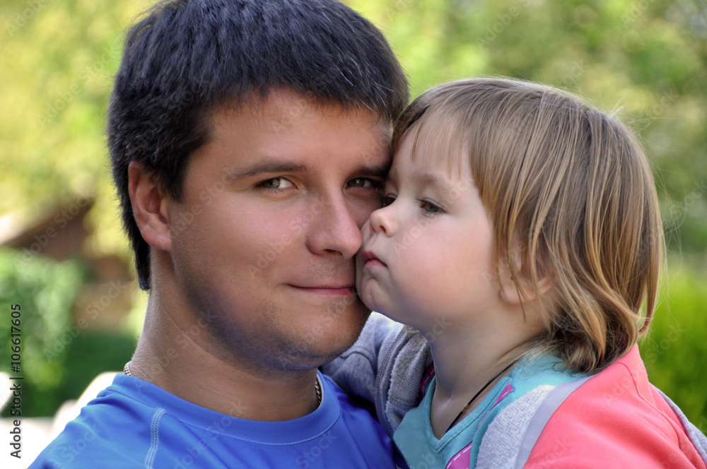 Loving daughter in the arms of his father Loving daughter in the arms of his father