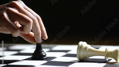 Black pawn moves and wins a chess game.