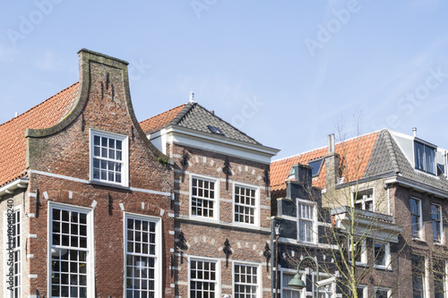 A skyline of vintage buildings roofs in the old downtown of Delft, Netherlands.