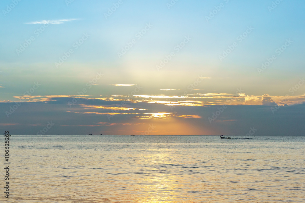 Fototapeta premium Sunset on the beach with beautiful sky in Thailand, Phuket. Boats on horizon.