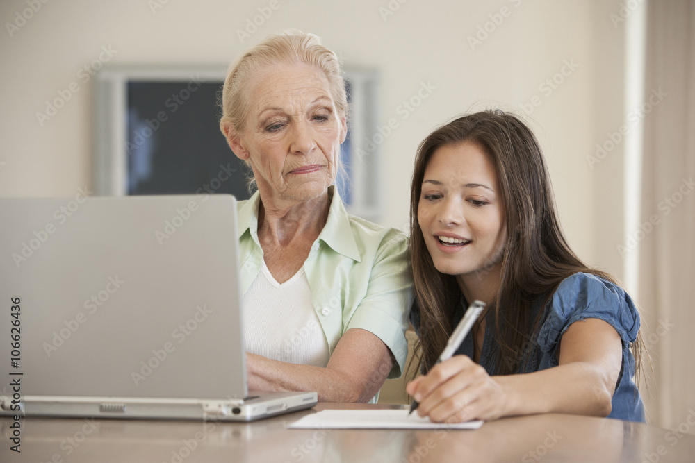 Caucasian mother and daughter using laptop Caucasian mother and daughter using laptop