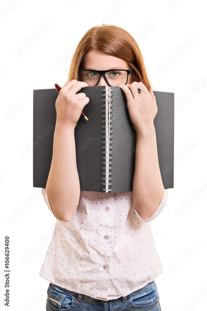 Female student hiding behind her book