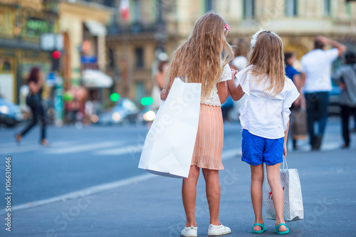 Adorable fashion little girls outdoors in European city