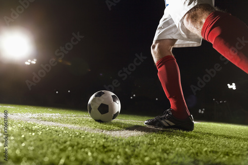 Soccer player making a corner kick photo