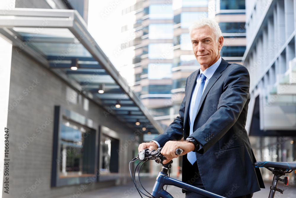 Successful businessman riding bicycle Successful businessman riding bicycle