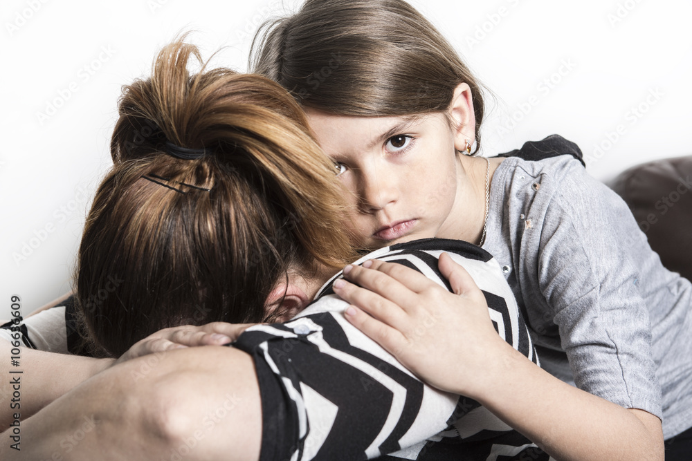 sad mother consoling by his child sad mother consoling by his child