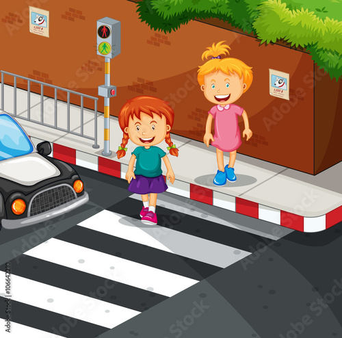 Two girls crossing the road