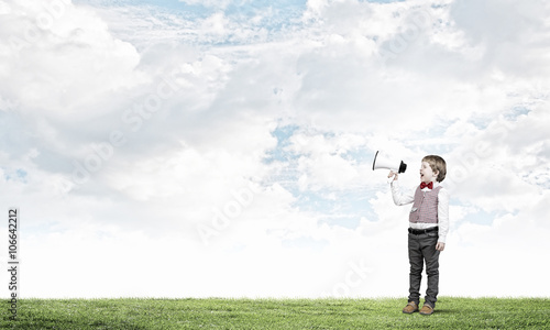 Kid boy with megaphone © Sergey Nivens