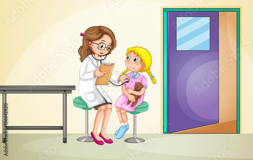 Doctor examining little girl