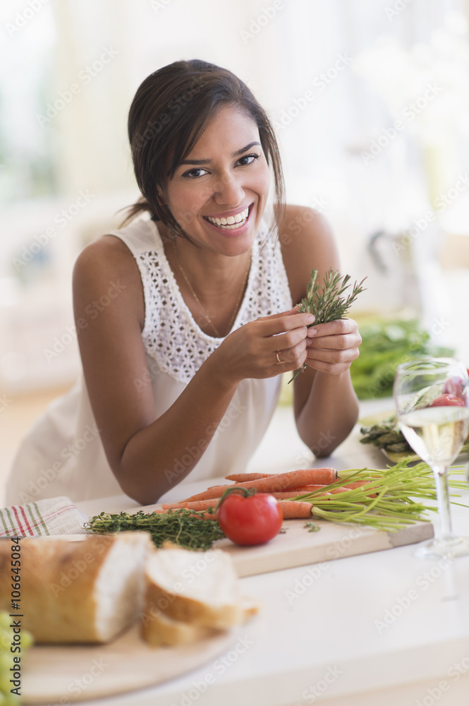 Hispanic woman cooking in kitchen Hispanic woman cooking in kitchen