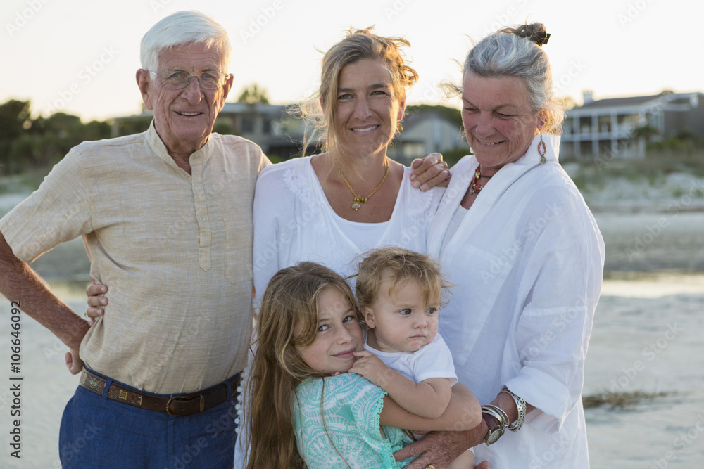 Caucasian family smiling on beach Caucasian family smiling on beach