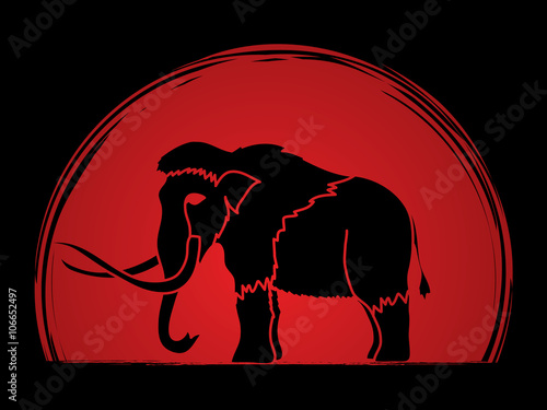 Mammoth designed on sunset background graphic vector. photo