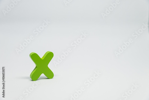 Green Wooden alphabet X with white background