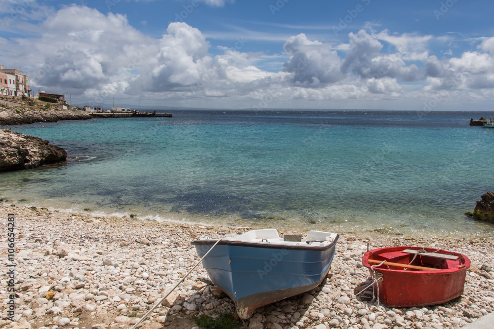 Two little boats on the beach of a mediterranean island, Sicily, Italy, Levanzo Two little boats on the beach of a mediterranean island, Sicily, Italy, Levanzo