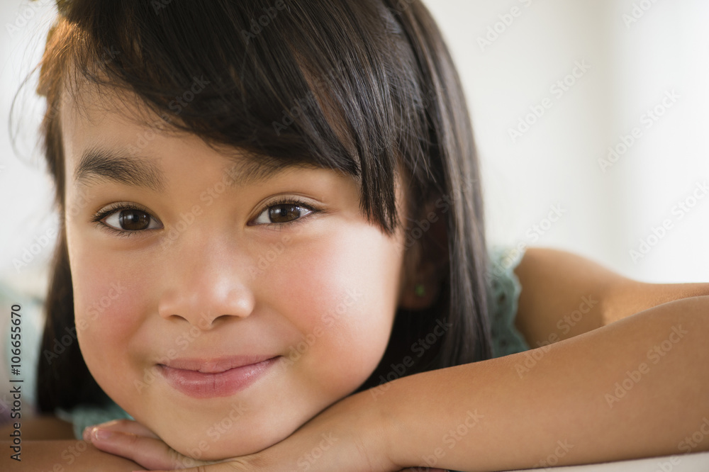 Filipino girl resting chin in hands Filipino girl resting chin in hands