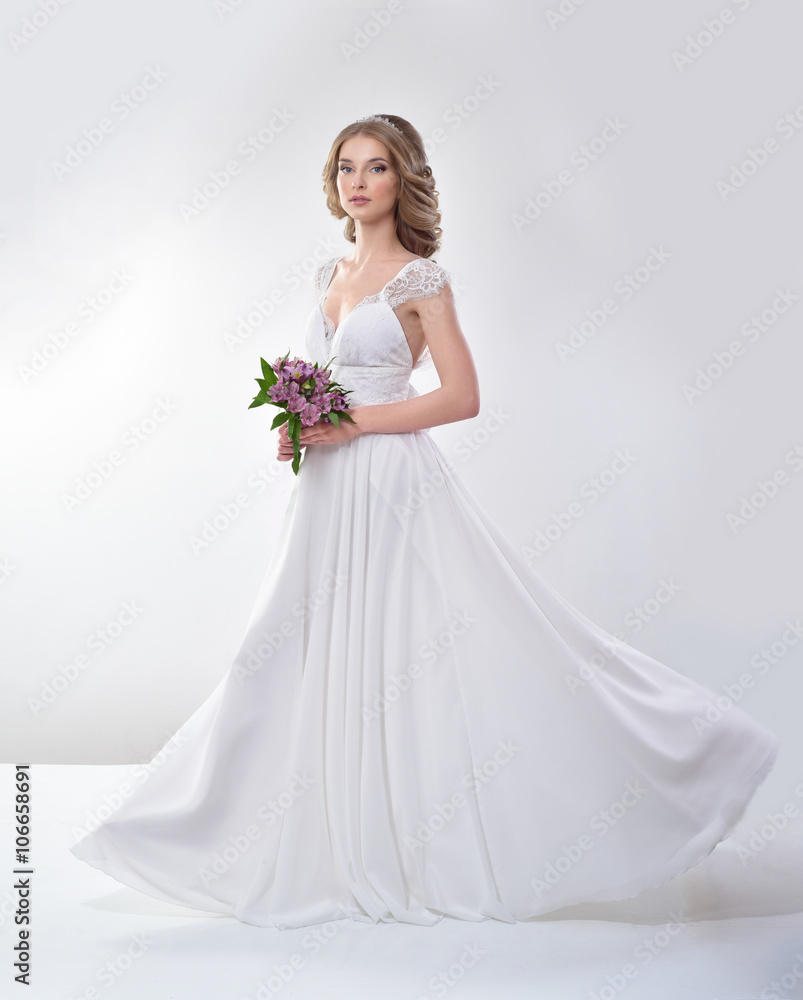 Beautiful bride in a luxurious wedding dress Beautiful bride in a luxurious wedding dress