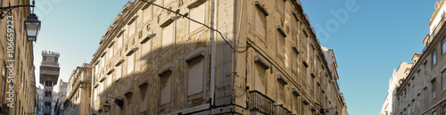 Wide panorama of the upper façades in central Lisbon’s lower town or Baixa, with the Santa Justa Lift, or Elevador de Santa Justa.