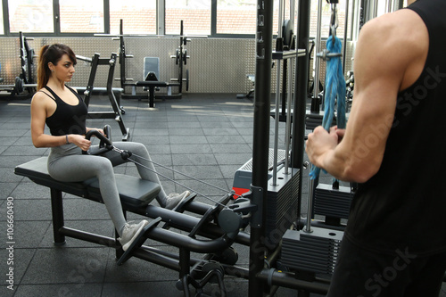 Muscular woman doing pulling exercises