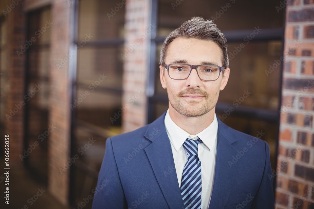 Fototapeta premium Confident businessman standing in office