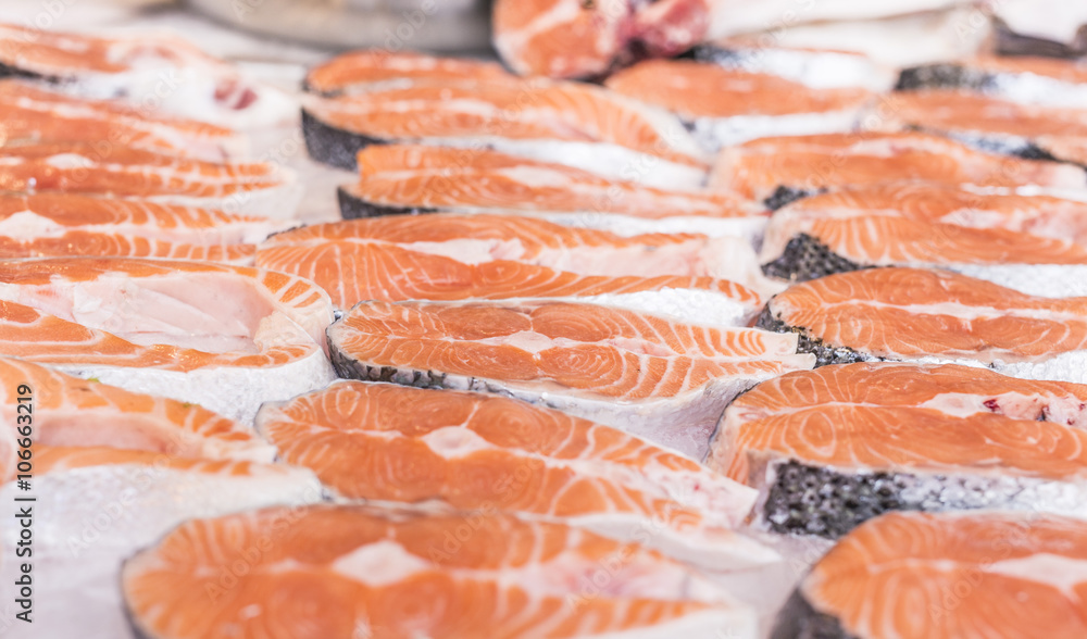 salmon slices on crushed ice - fresh raw meat salmon slices on crushed ice - fresh raw meat