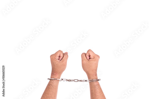 Close up hands with silver handcuffs isolated on white