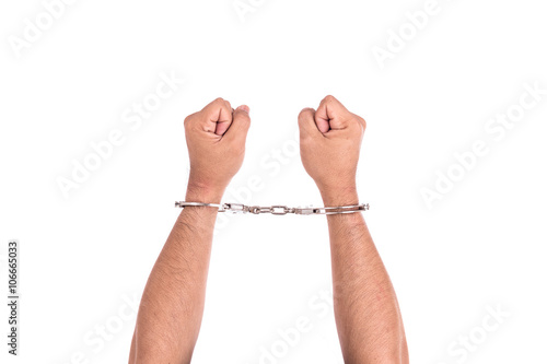 Close up hands with silver handcuffs isolated on white