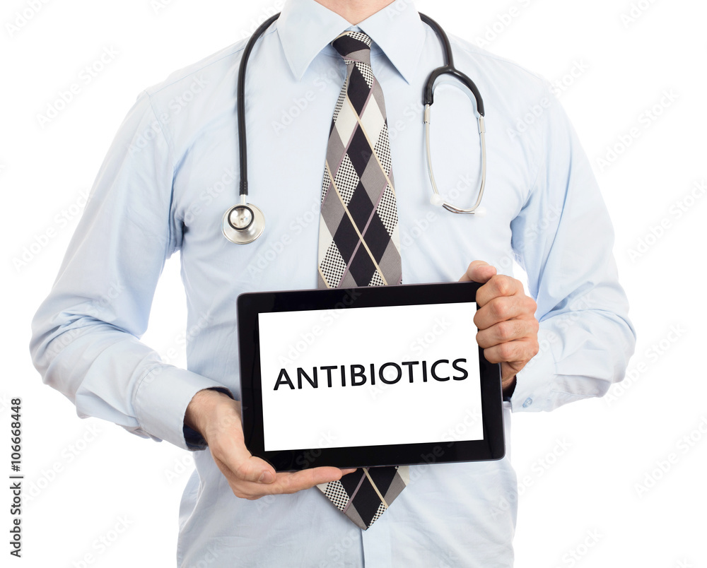 Doctor holding tablet - Antibiotics Doctor holding tablet - Antibiotics