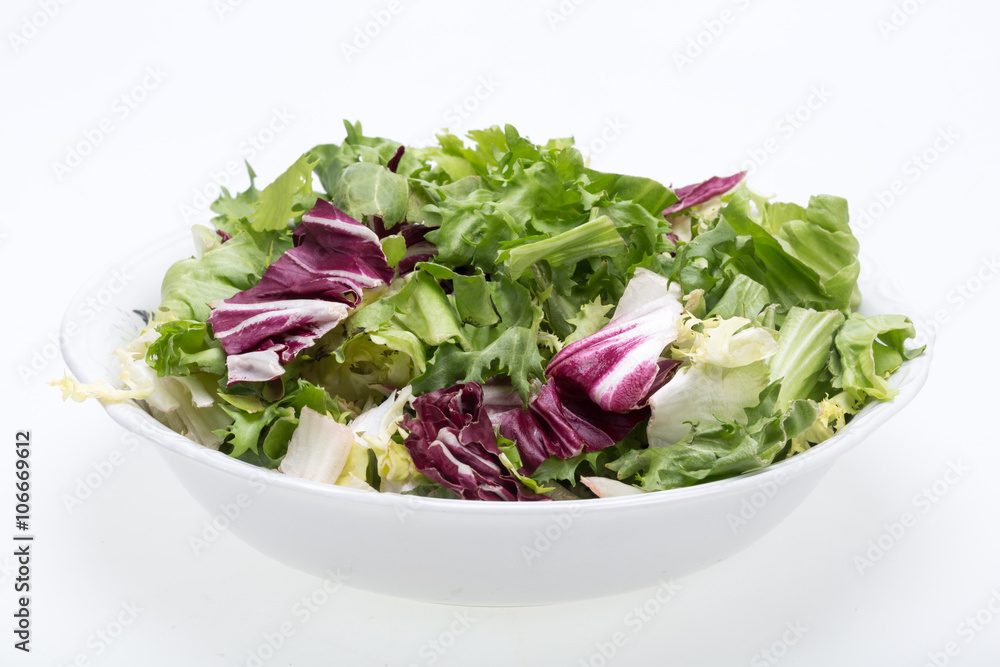 Green and red leaf of lettuce . Isolated on a white background Green and red leaf of lettuce . Isolated on a white background