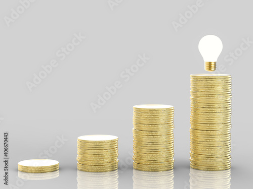 business success idea with stack of golden coins and idea light bulb