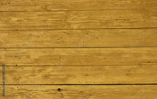 Yellow weathered wooden wall texture.